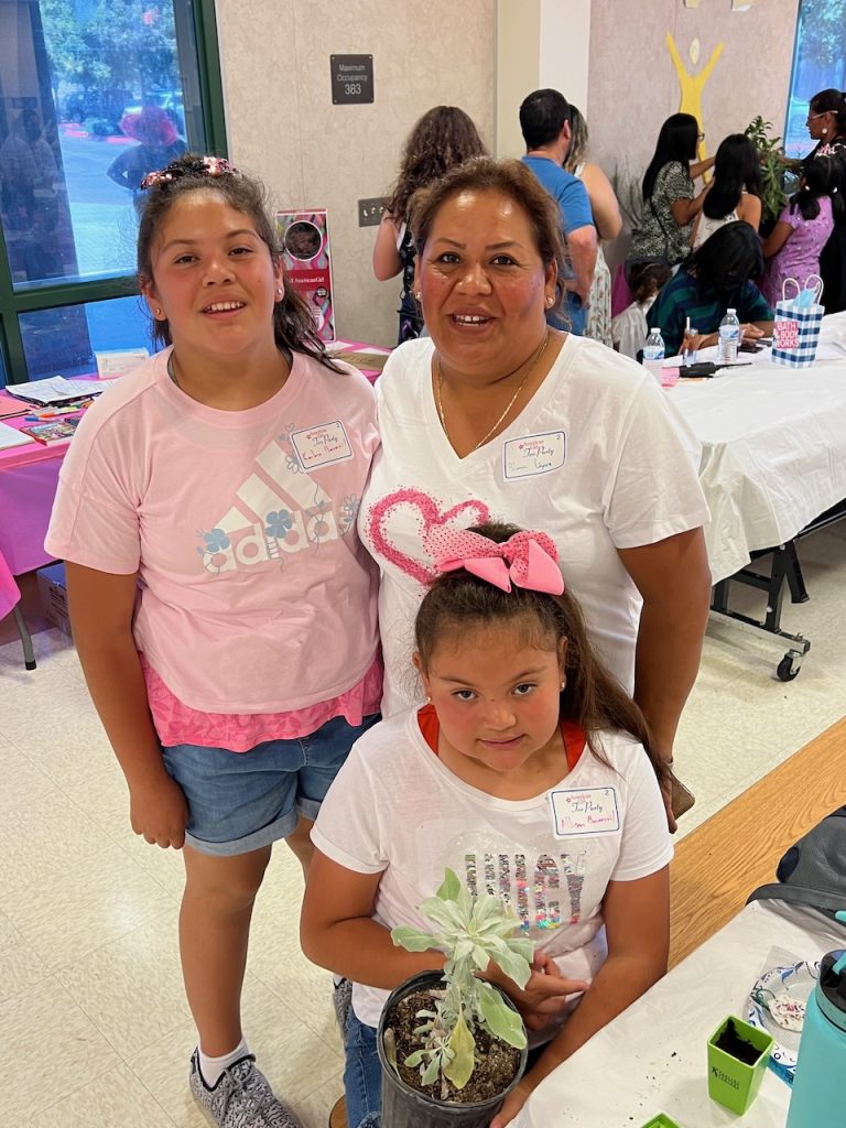 Photo caption: Blanca Lopez from San Bernardino brought her daughters Kailey and Allison Becerril, who are excited about their new milkweed plant. “We are going to have lots of butterflies at our house,” said Allison.