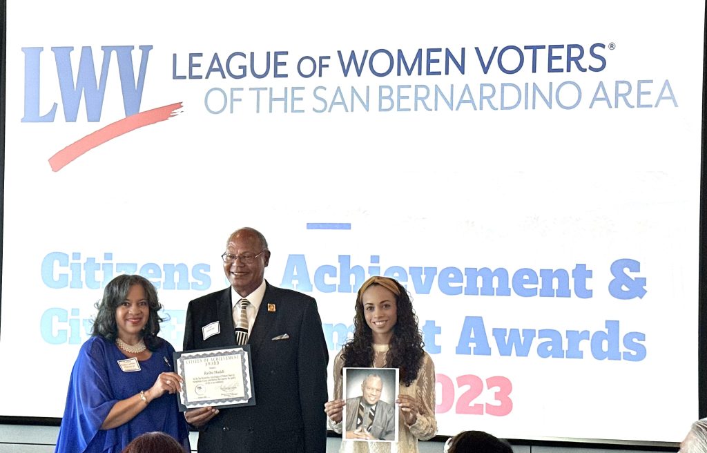 The League of Women Voters recognized Ratibu as a Citizen of Achievement. Ratibu award acceptance by Carl M. Dameron & Teriki Shani Thillet presented by Twilla Carthen.  