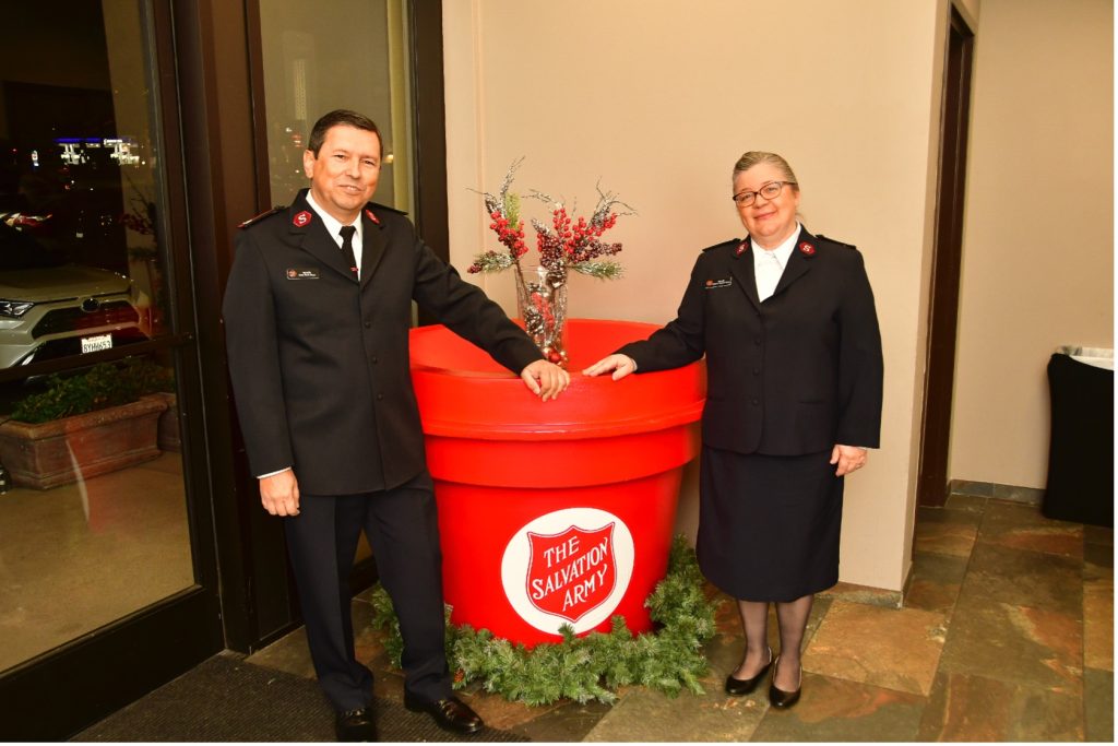 Photo Caption: Majors Isaias and Adelma Braga welcome donors to The Annual Red Kettle Kickoff. This year’s event is Wednesday, November 15th, at 5:30 pm at the Bear Springs Events Center,  27923 Highland Avenue, Highland, CA 92346. Click here for tickets.
