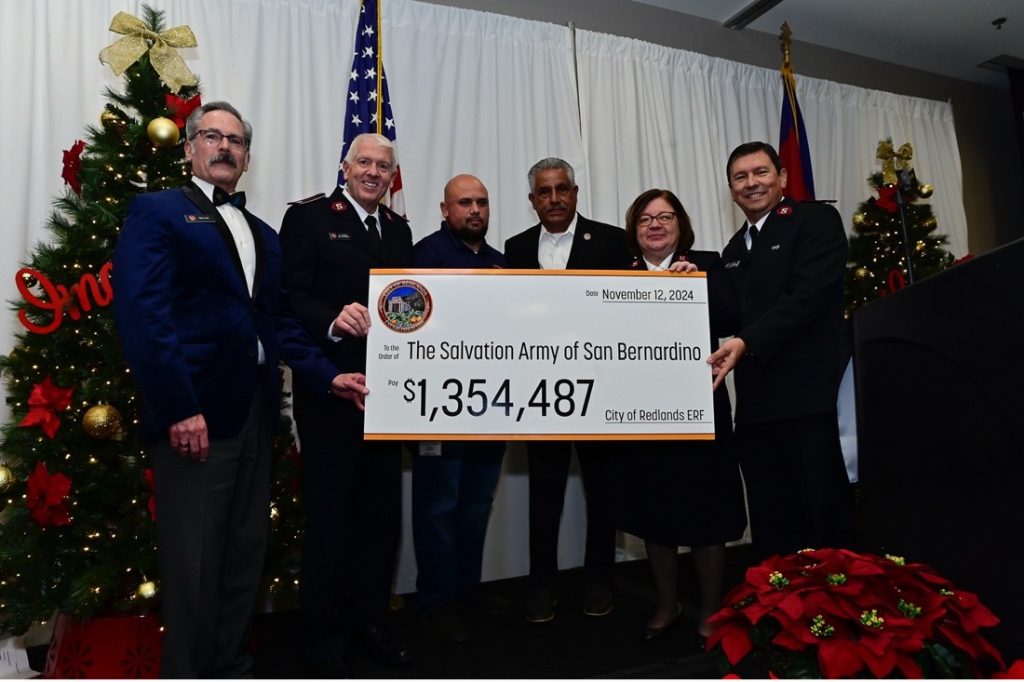 PHOTO CAPTION: The City of Redlands presented a check for $1,354,487 in grant funds to the San Bernardino Citadel of The Salvation Army at the Red Kettle Kick-Off Event on November 12th. Left to Right: Lt. Colonel Mike Dickinson, Divisional Commander; David Rabindranath, Homeless Solutions Manager for the City of Redlands; Mario Saucedo, Redlands Council Member; Major Adelma Braga, and Major Isias Braga, San Bernardino Salvation Army Citadel Commanders. 