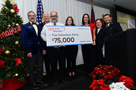 PHOTO CAPTION: Stater Bros. presented a check for $75,000, $15,000 for the San Bernadino Citadel and $60,000 to other Salvation Army corps, to help fund food giveaways and sit-down meals for needy individuals and families in the Inland Empire. From left are Southern California Divisional Director of Development and Communication Peter Irwin, SVA Lt. Colonel Mike Dickinson, Tasso Panos, Stater Bros. Markets Store Manager, Loni Maxfield Stater Bros. Charities Coordinator, Nancy Negrette, Stater Bros. Charities Chairman and President and SVA Majors Adelma and Isaias Braga.